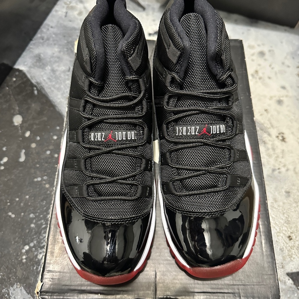 Jordan Black and Red Sneakers with Patent Leather 11s